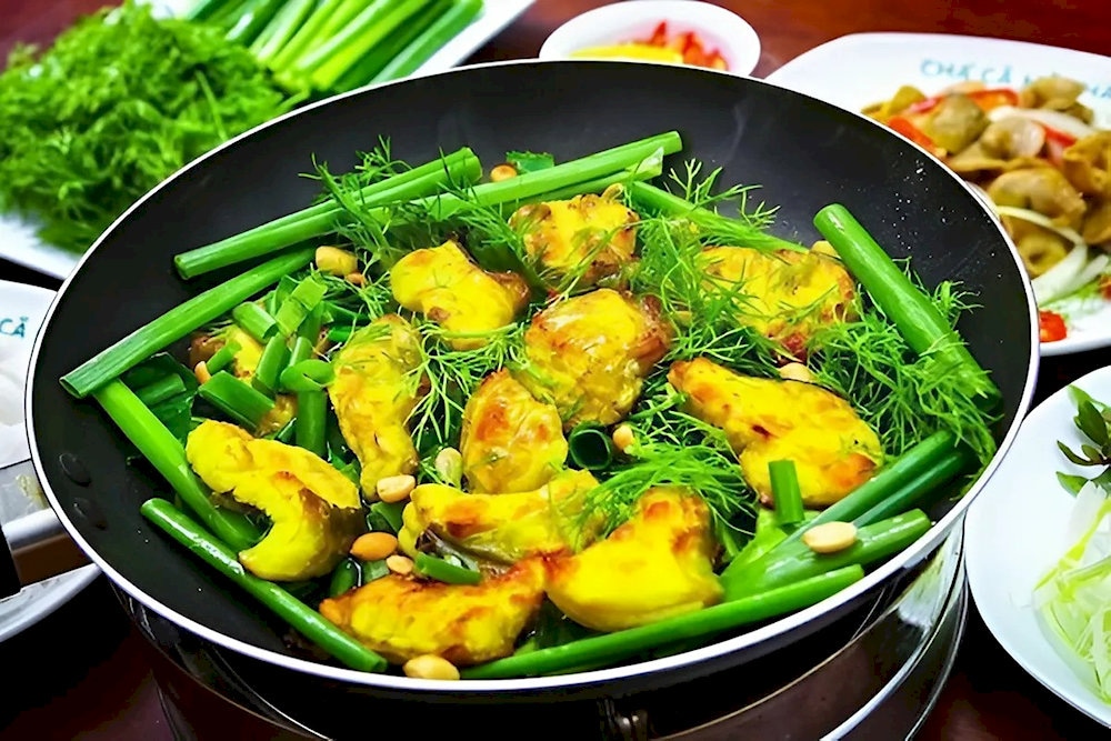 The unique of Cha Ca La Vong is that it's served at the table on a sizzling hot plate, making it a fun and interactive experience